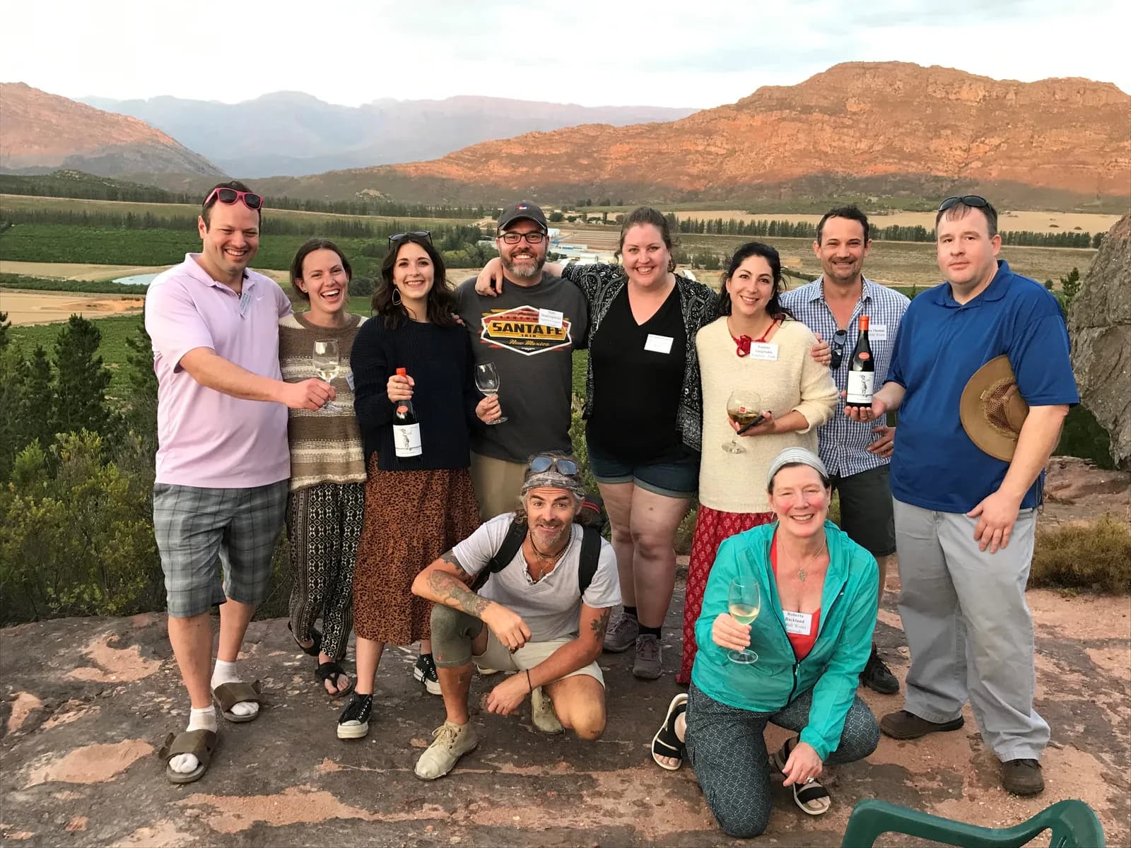Raising a glass with producer partners at sunset over the winelands