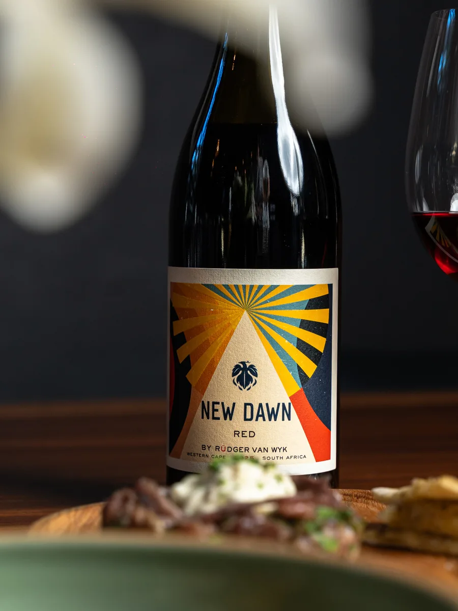 A New Dawn bottle paired with a plated dish